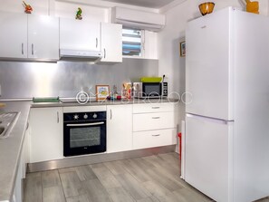 Comfort Villa | Private kitchen | Fridge, microwave, stovetop, espresso maker