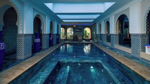 A pool with a clear blue water surface, surrounded by arches with intricate tile patterns, and a ceiling with skylights allowing natural light. - Janat Al Atlas Resort & Spa (Marrakech)