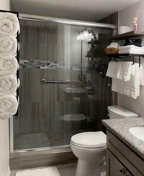 Shower, hair dryer, towels, soap
