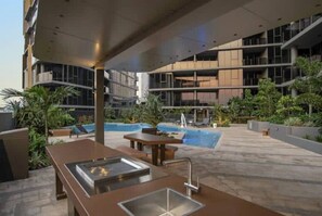 Outdoor pool, sun loungers - Sunset Views From Our Cute and Clean Studio (South Brisbane)