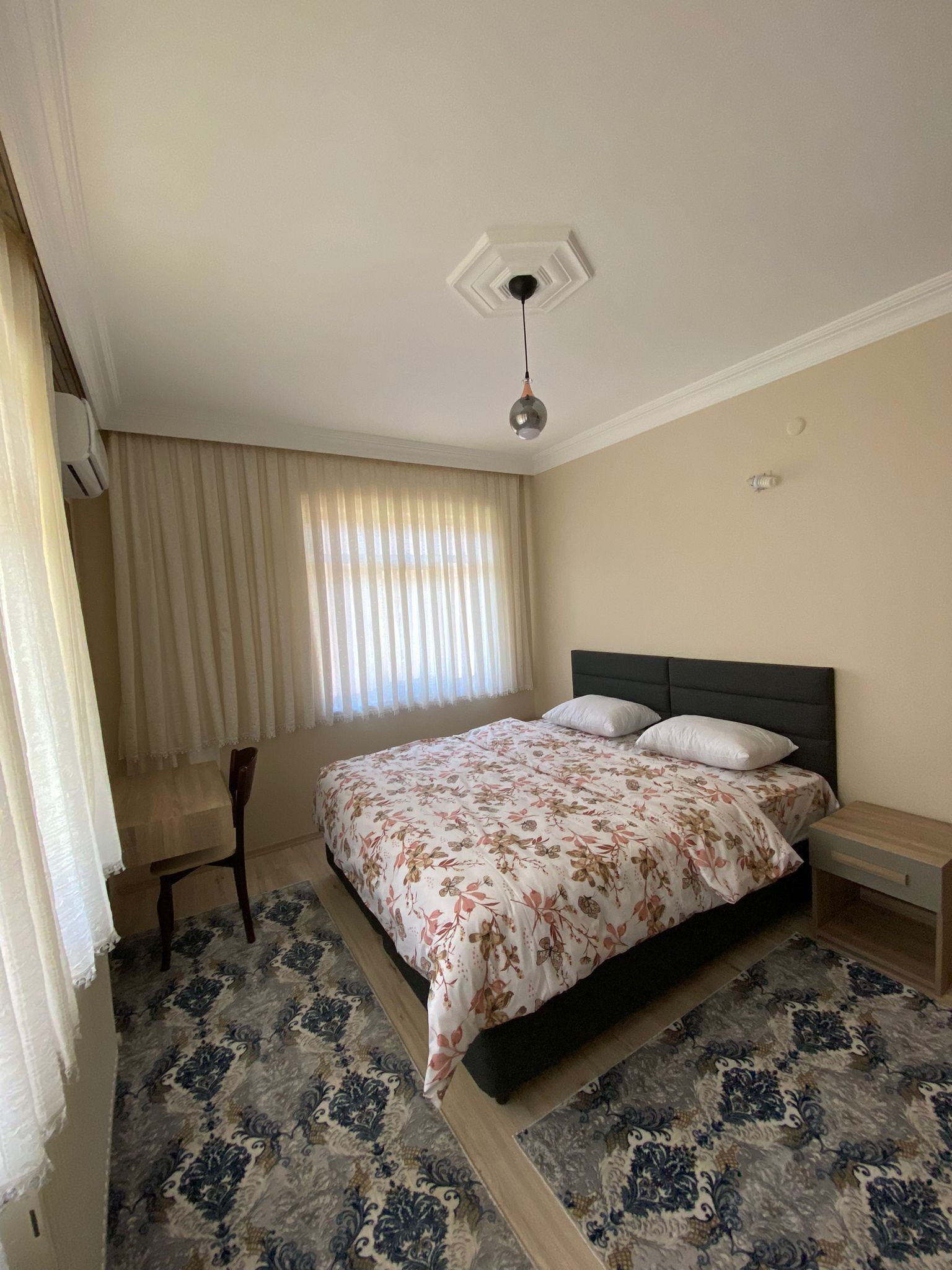 hypo-allergenic bedding, desk, laptop workspace, blackout curtains