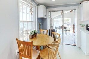 Enjoy meals in the open-plan kitchen and dining area with a view of the outdoors.