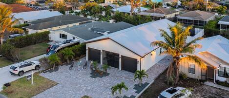 A residential area with houses, a garage, and a driveway.
