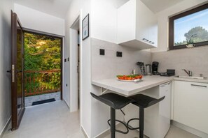 Fridge, microwave, stovetop, coffee/tea maker