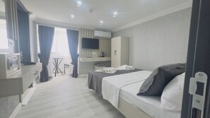 Egyptian cotton sheets, premium bedding, in-room safe, desk