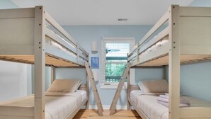 A bunk bed room with a window and a picture on the wall. - 4 Bed | Hot Tub | Close to IU | Pet Friendly (Bloomington)