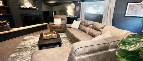 Smart TV, fireplace, books, printers