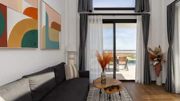 Signature Villa | Living area | Flat-screen TV