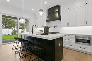 Fridge, microwave, oven, stovetop - Lavish & Spacious Home in Walkable Hyde Park (Tampa)