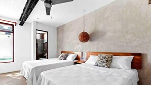 A hotel room with two beds, a large window, a hanging light fixture, and a view of the outside. - VICA GUEST HOUSE (Cancun)