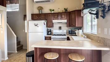 Microwave, coffee/tea maker, toaster, cookware/dishes/utensils