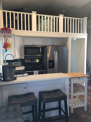 Fridge, microwave, stovetop, coffee/tea maker