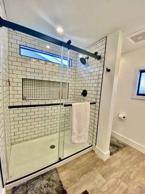 Shower, hair dryer, towels
