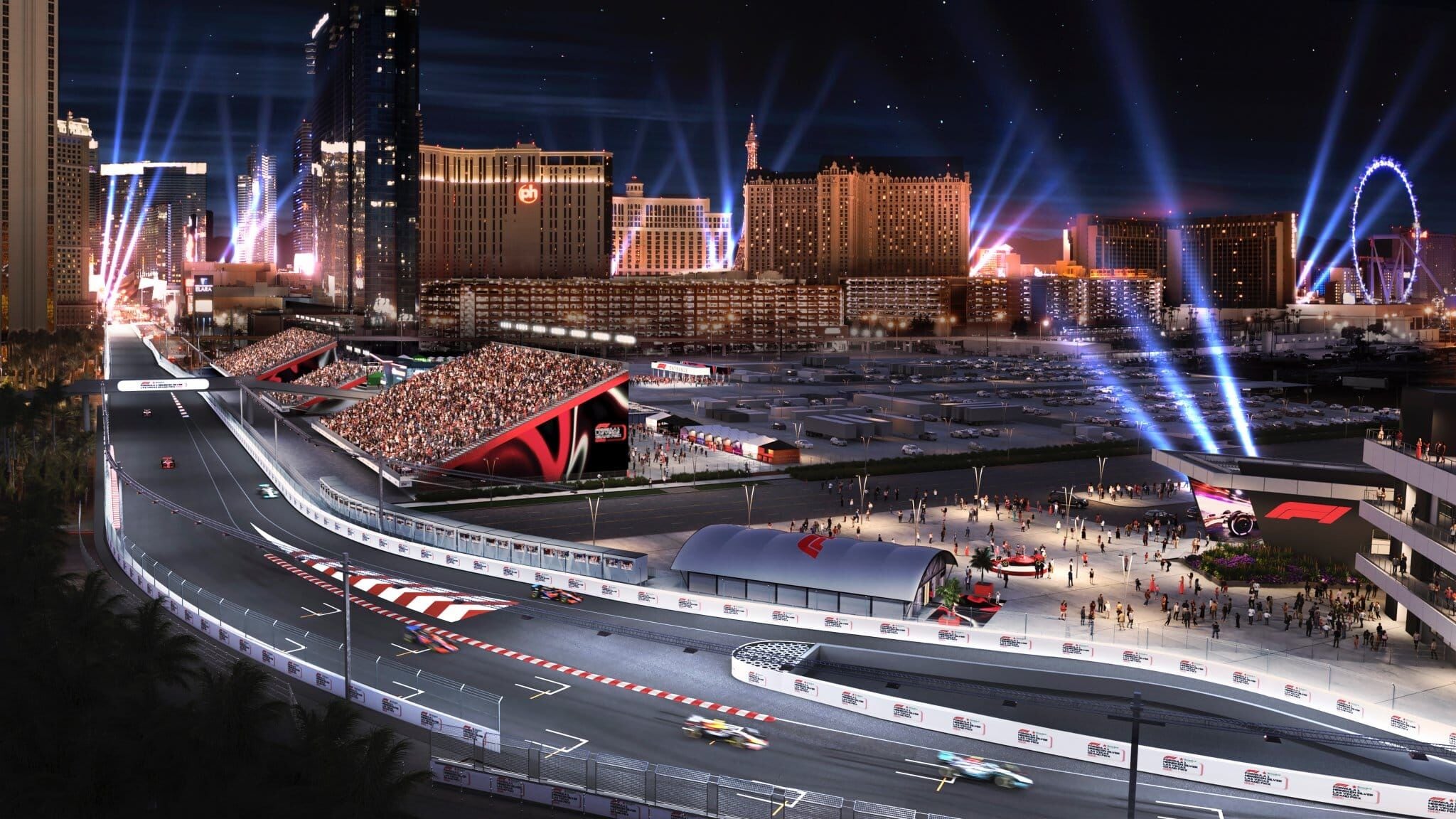 A nighttime view of a racetrack with a large stadium, city skyline, and illuminated buildings.