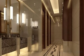 A modern bathroom with marble countertops, a large mirror, and a patterned floor. - Century Yuan International hotel(Jiangyan,Taizhou) (Taizhou)
