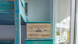 A narrow staircase with blue-painted wooden steps leading to a window. - 🌅 Ocean-View 2-Bedroom Suite #2 at Villa Costa Vida (Quepos)