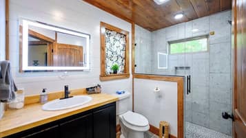 Shower, hair dryer, towels, shampoo