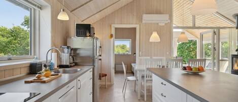 Fridge, stovetop, dishwasher, coffee/tea maker