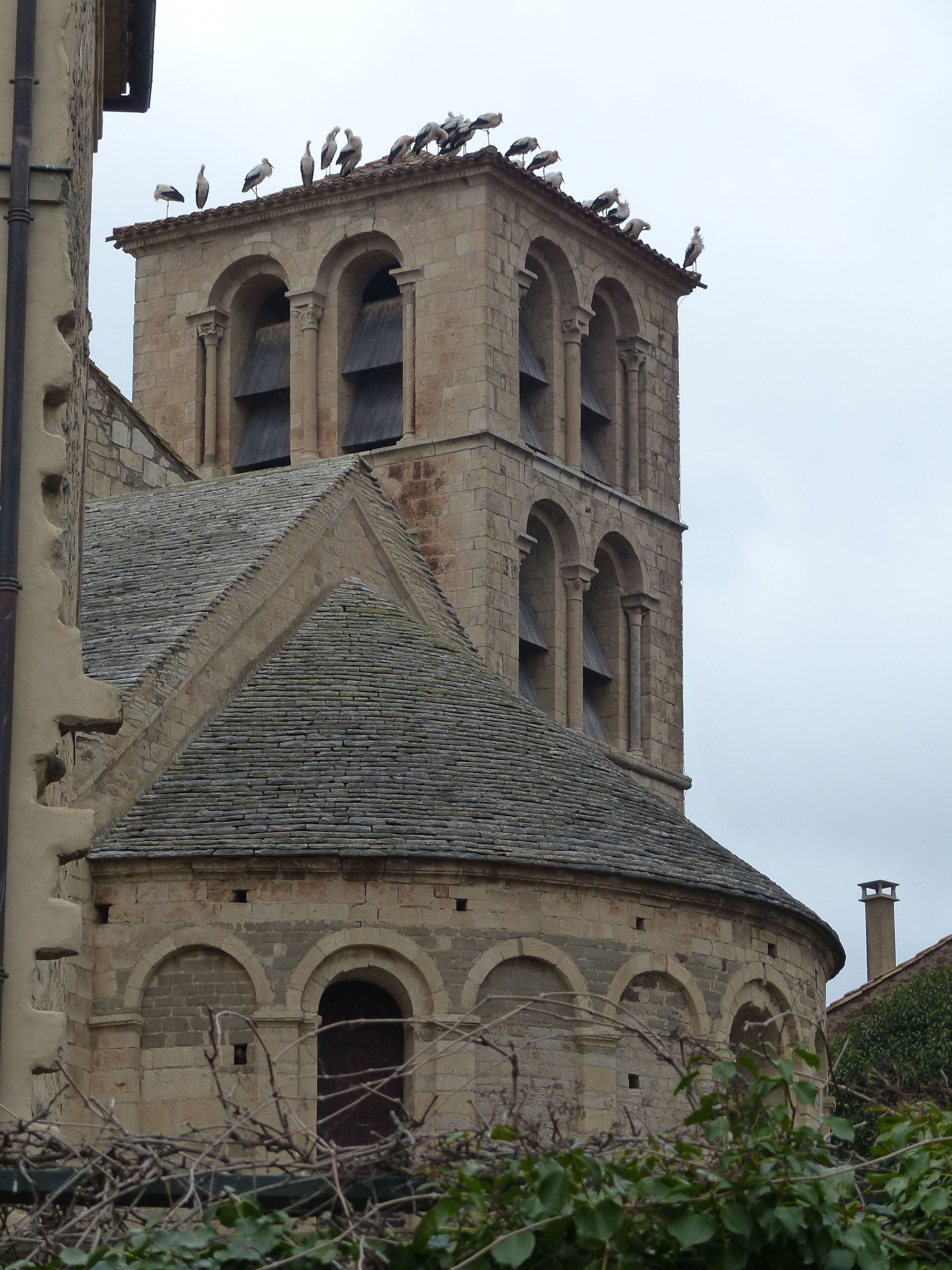 A historic building with a bell tower and arched windows.