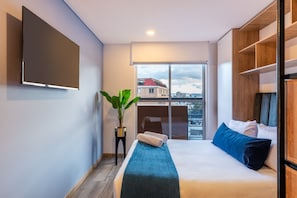 Premium bedding, down duvets, desk, laptop workspace