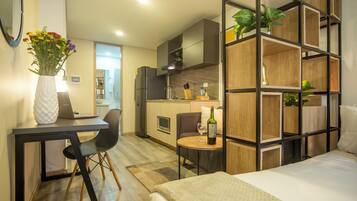 Studio (E) | Premium bedding, down comforters, desk, laptop workspace