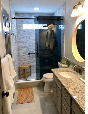 Shower, hair dryer, towels, soap