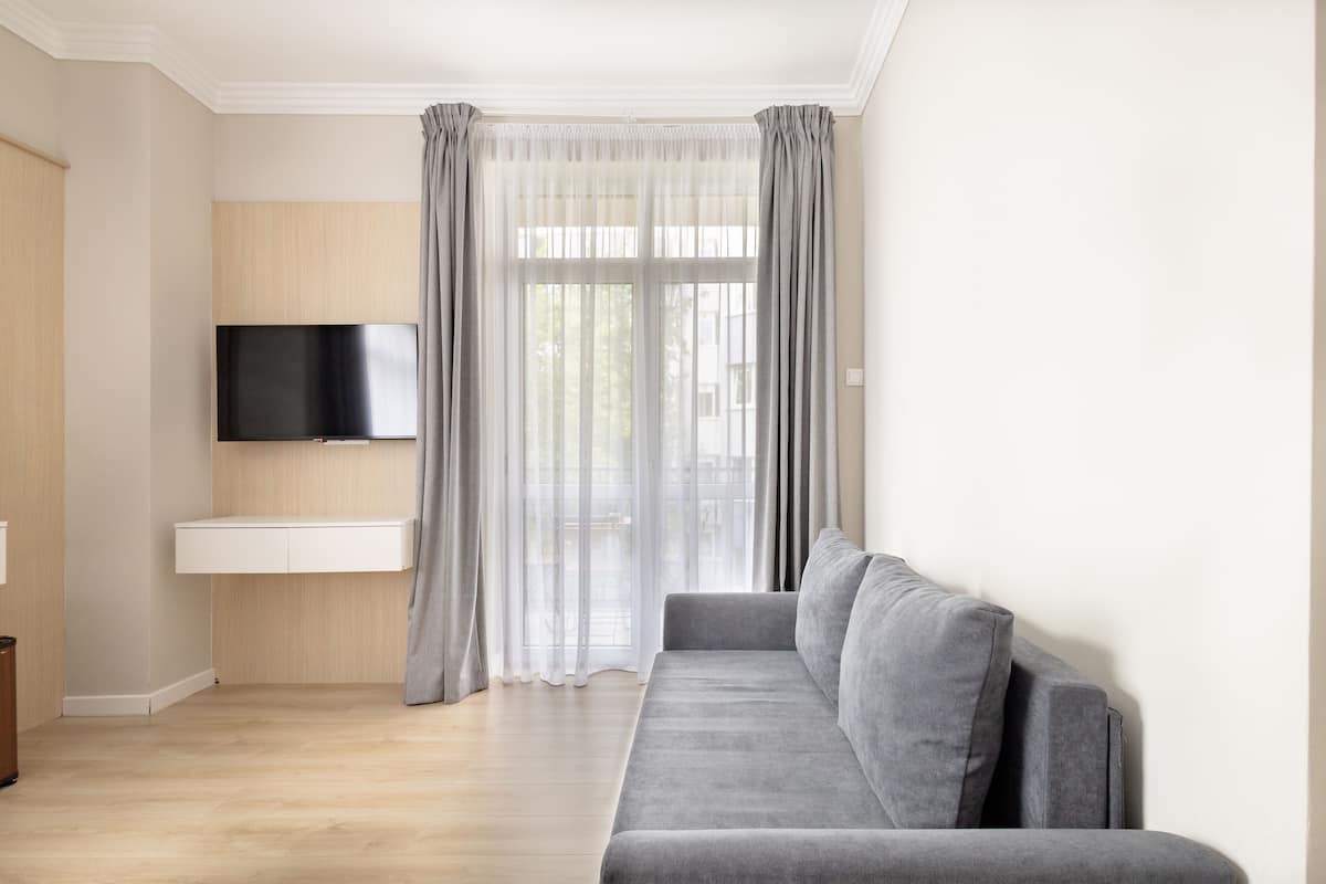 Chambre Triple Confort | Coin séjour