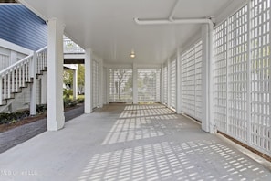 Staircase leads to an upper level in this open outdoor area.