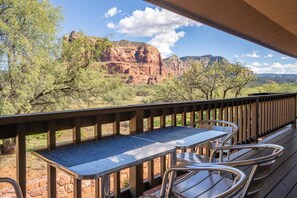 Relax on the deck with a breathtaking view of the surrounding mountains.