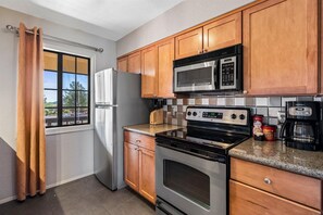 Condo, 2 Bedrooms | Private kitchen | Fridge, oven, coffee/tea maker