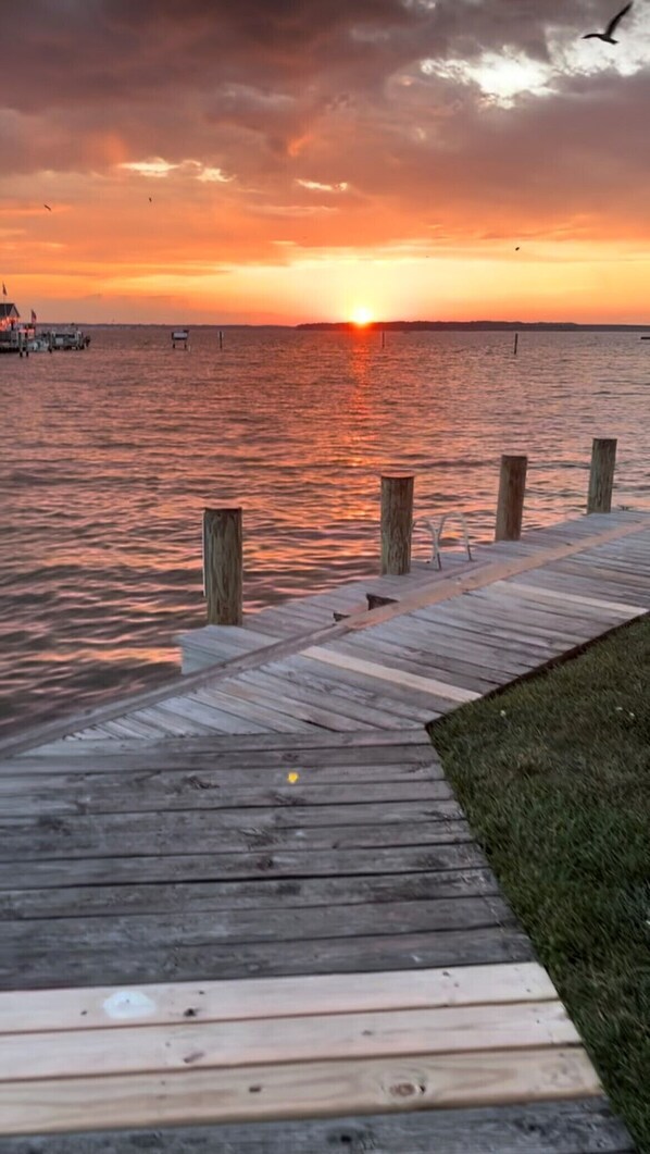 Guests can stroll along the pier, taking in the serene views of the surrounding water.