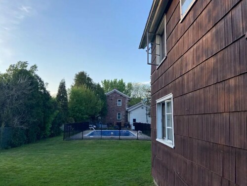 Cozy 1800’s carriage house with knotty pine,  exposed beams, and loft area