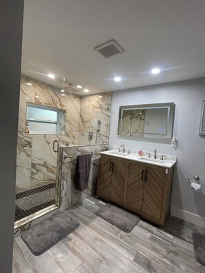 Shower, hair dryer, towels, soap