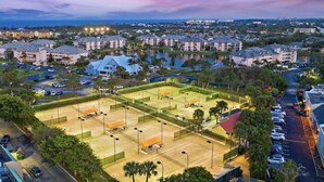 A large sports complex with multiple tennis courts, surrounded by residential buildings and a parking area. - Jupiter Dreams at Jupiter Bay! 2 bedroom, 2.5 bath Condo. Close to the beach!  (Jupiter)