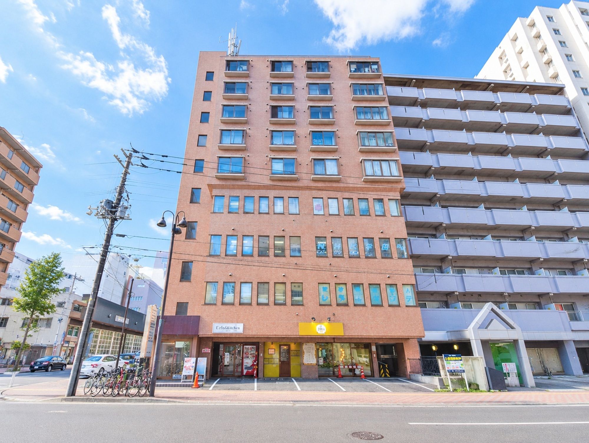 A multi-story building with a ground-floor cafe and restaurant.