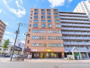 A multi-story building with a ground-floor cafe and restaurant.
