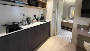 Superior Studio, 1 King Bed | Private kitchen | Microwave, electric kettle