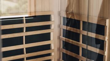 A wooden sauna with benches and a bench seat.