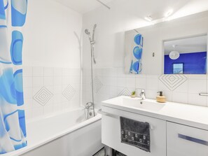 Bathtub, hair dryer, towels, soap