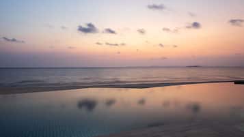 2 outdoor pools, open 7:00 AM to 7:00 PM, free cabanas, pool umbrellas