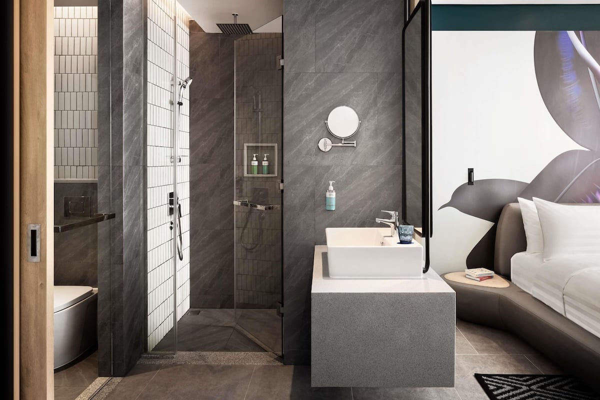 Premium bedding, desk, laptop workspace, soundproofing