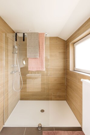 Shower, towels, soap, toilet paper