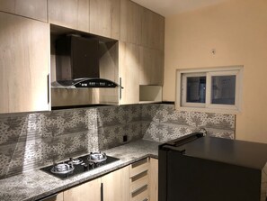 Fridge, microwave, stovetop, electric kettle - Modern 2 Bedroom Apartment in Clifton Karachi  (Karachi)