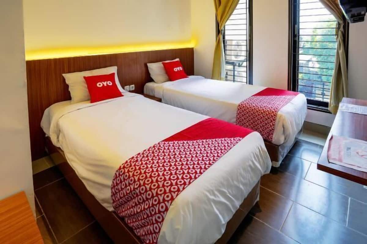 Laptop workspace, bed sheets