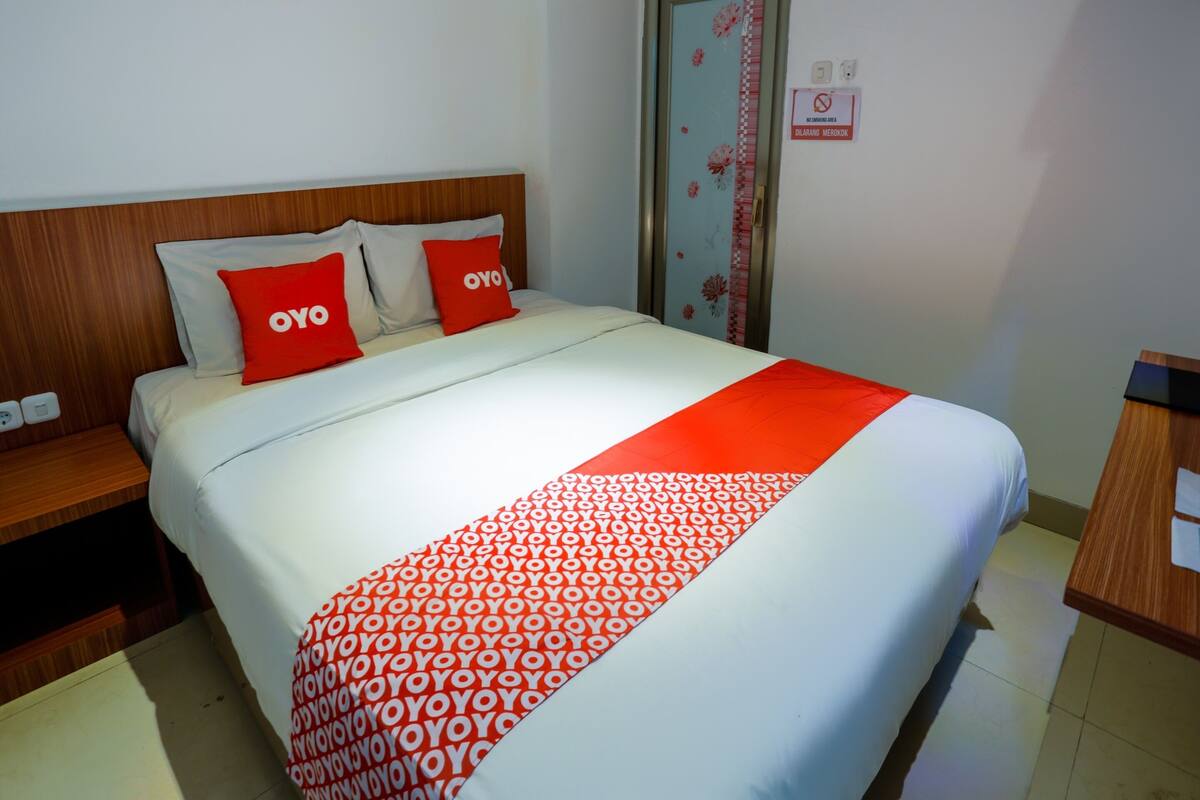 Laptop workspace, bed sheets