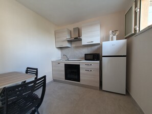 Chambre Quadruple Luxe | Cuisine privée