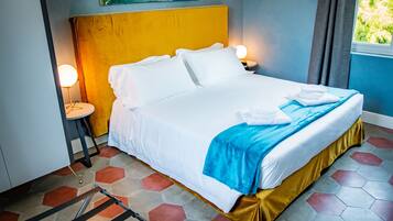 Deluxe Quadruple Room | Hypo-allergenic bedding, down comforters, memory foam beds, minibar