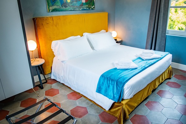 Deluxe Quadruple Room | Hypo-allergenic bedding, down comforters, memory foam beds, minibar