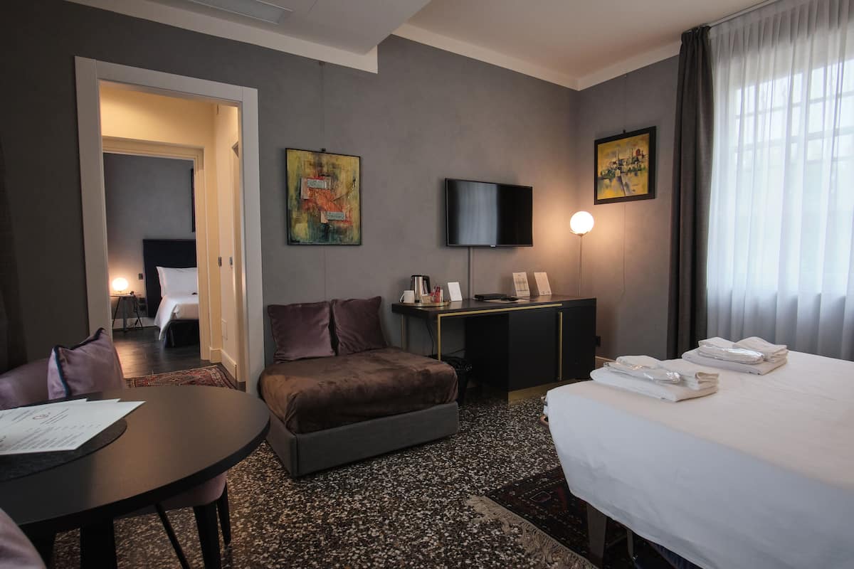 Family Quadruple Room | Hypo-allergenic bedding, down comforters, memory foam beds, minibar