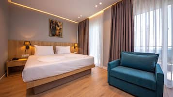 Deluxe Double Room, Balcony, Sea View | 1 bedroom, in-room safe, desk, blackout drapes